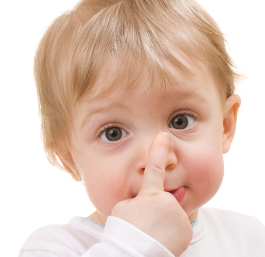 Child with finger on nose